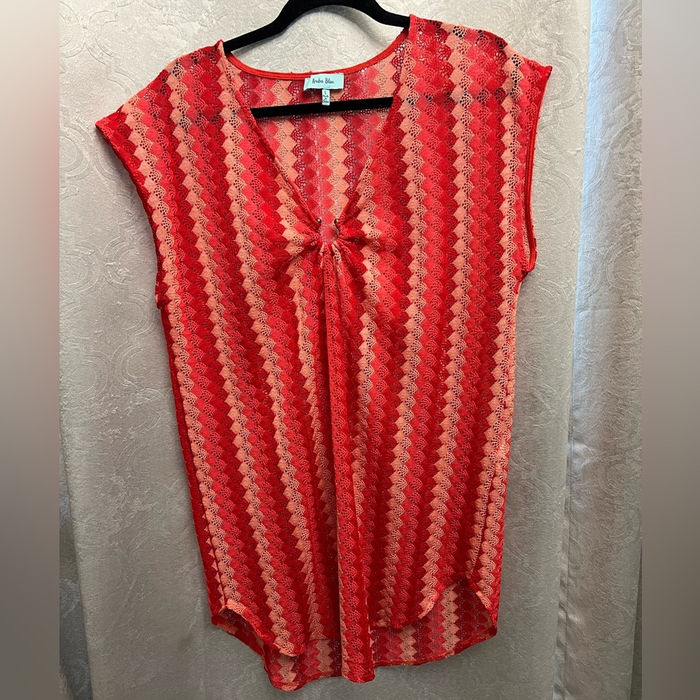 Swimsuit coverup. Striped in shades of orange.